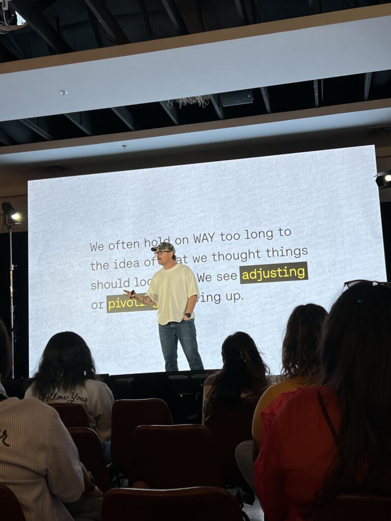 Chris Mistrick's Seasons & Assignments talk during Spark 2025 conference. Chris on stage with a microphone.